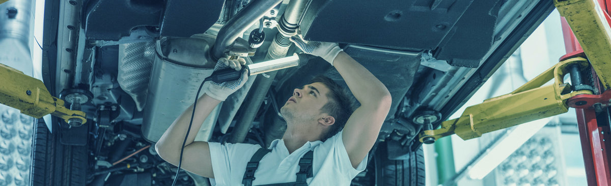 Mechanic doing an MOT inspection on a vehicle - MOT Newcastle Upon Tyne