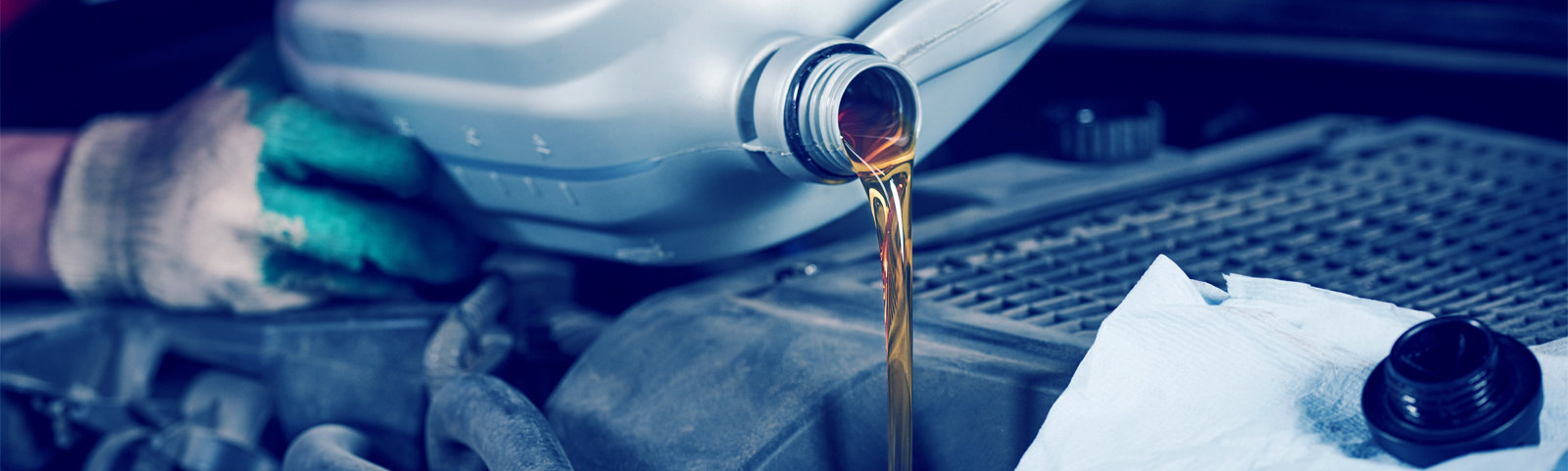 Mechanic pouring oil into a vehicle - Car Servicing Newcastle Upon Tyne